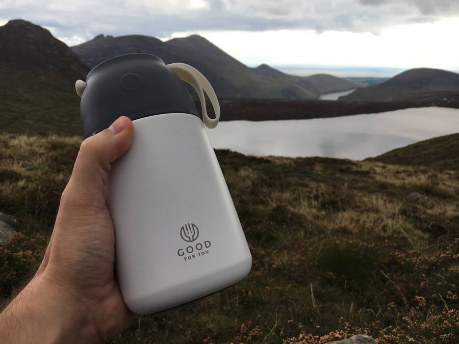 a food flask with mountains in the background